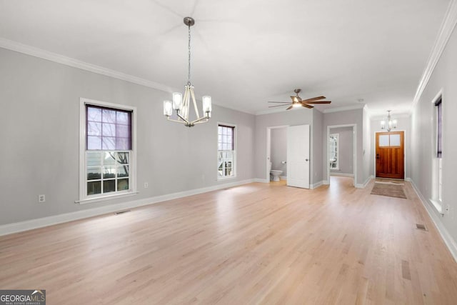 unfurnished living room with ceiling fan with notable chandelier, light hardwood / wood-style floors, and crown molding