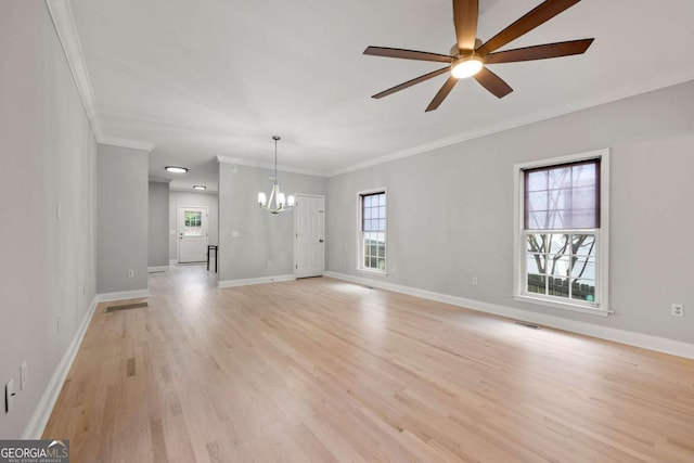 unfurnished living room featuring light hardwood / wood-style floors, ceiling fan with notable chandelier, and ornamental molding