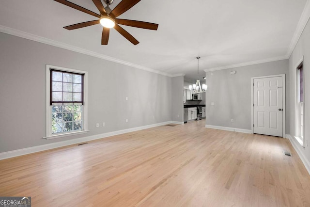 unfurnished living room with ceiling fan with notable chandelier, light hardwood / wood-style floors, and ornamental molding