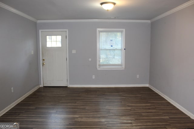 foyer entrance with crown molding and dark hardwood / wood-style flooring