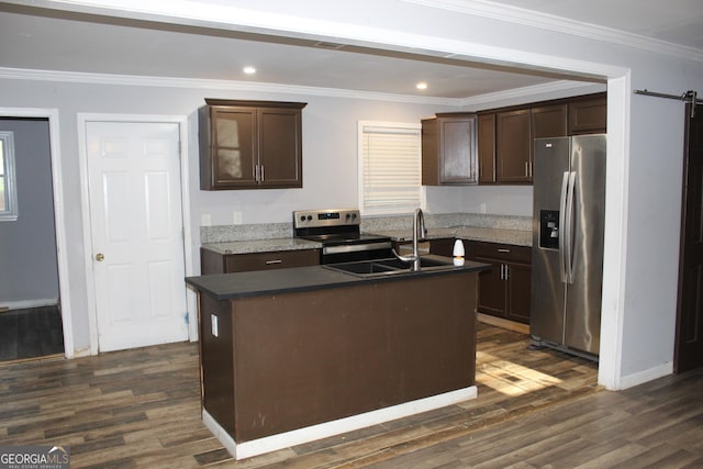 kitchen featuring a center island with sink, dark brown cabinetry, crown molding, and appliances with stainless steel finishes