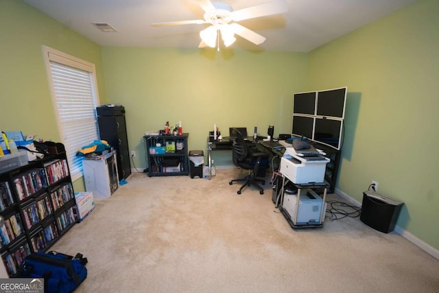 office featuring light carpet and ceiling fan