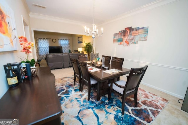 dining area featuring carpet flooring, a chandelier, and ornamental molding