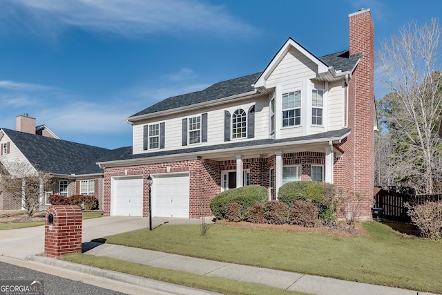 front facade with a front yard and a garage