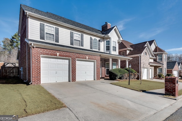 view of front property with a garage and a front lawn