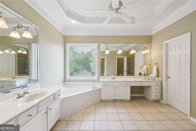 bathroom with a bathtub, vanity, a tray ceiling, ceiling fan, and tile patterned flooring