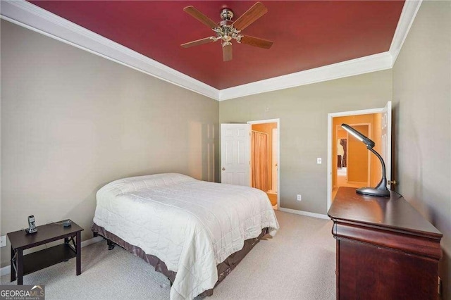 carpeted bedroom featuring ceiling fan and ornamental molding