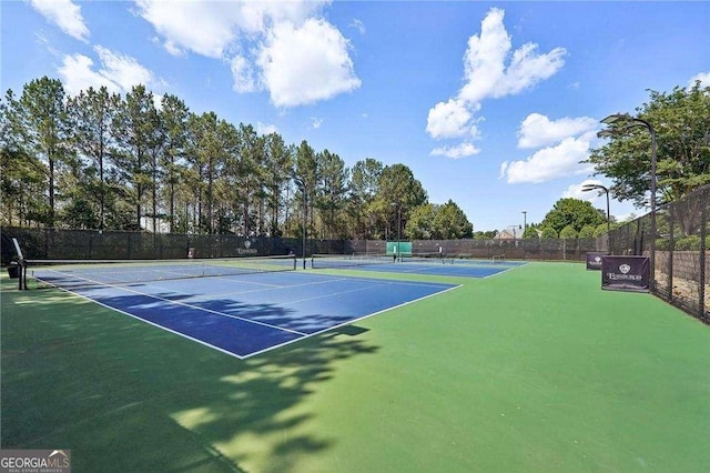 view of tennis court featuring basketball court