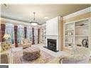 kitchen with a notable chandelier and white cabinetry