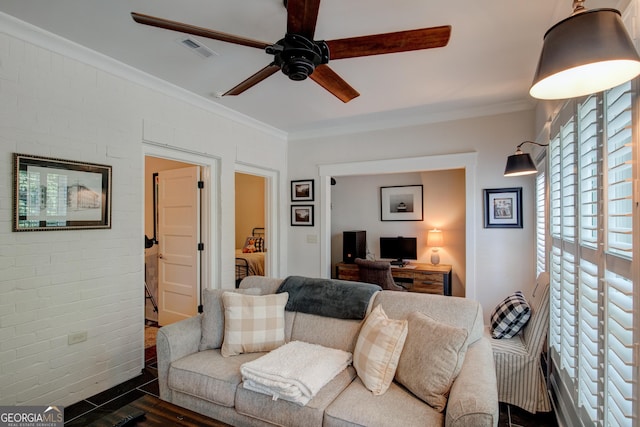 living room with ceiling fan and ornamental molding