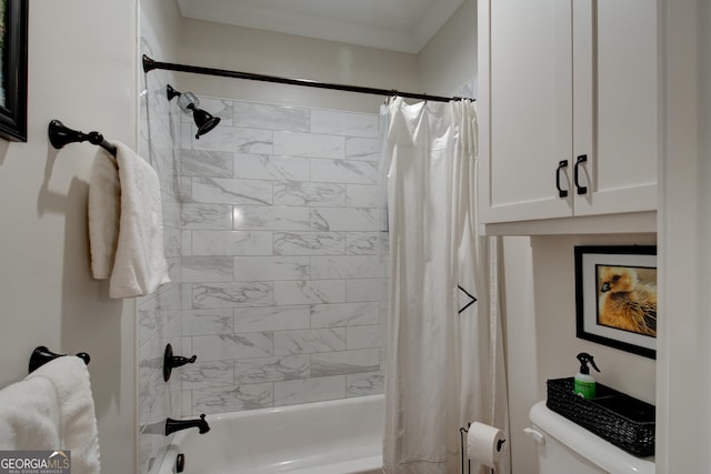 bathroom featuring shower / tub combo, toilet, and ornamental molding