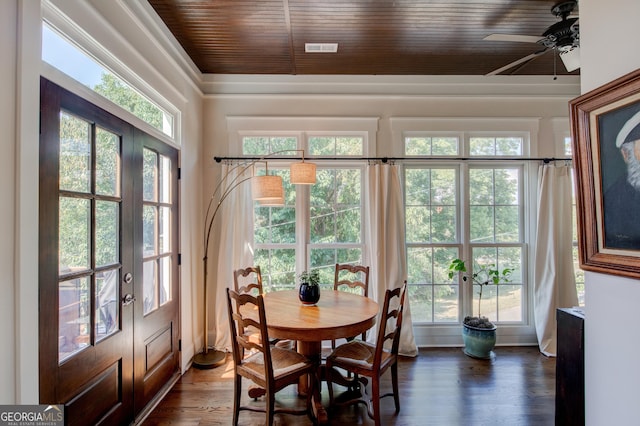 dining space with dark hardwood / wood-style flooring, plenty of natural light, ceiling fan, and wooden ceiling