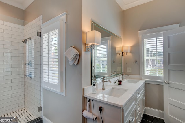 bathroom with tile patterned flooring, vanity, plenty of natural light, and crown molding