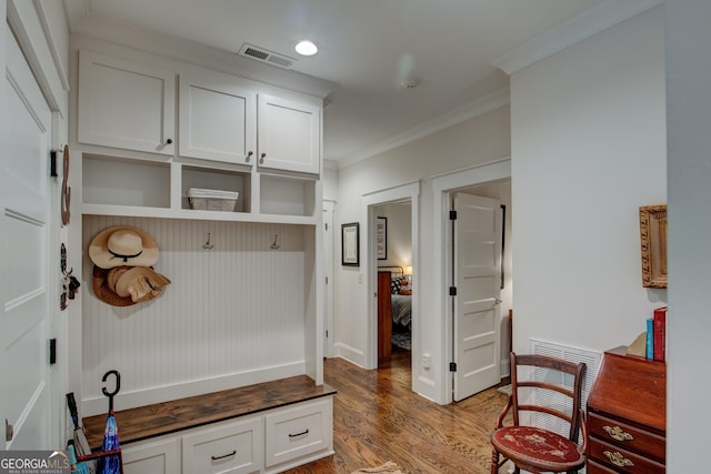 mudroom featuring hardwood / wood-style flooring and ornamental molding