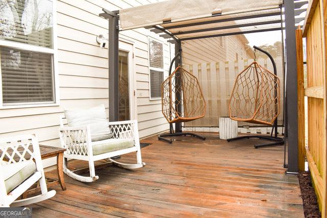 wooden deck featuring a pergola