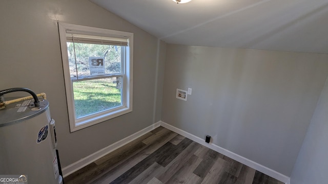 clothes washing area with dark wood-type flooring, hookup for a washing machine, and water heater