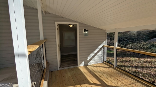 wooden terrace featuring covered porch