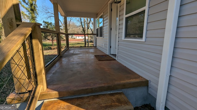 wooden terrace with a porch