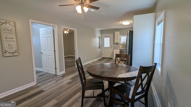 dining space featuring hardwood / wood-style flooring and ceiling fan