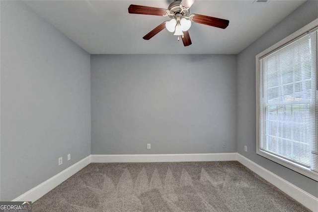 carpeted empty room with ceiling fan