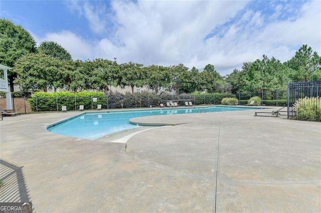 view of pool featuring a patio area