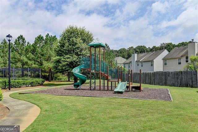 view of jungle gym featuring a lawn