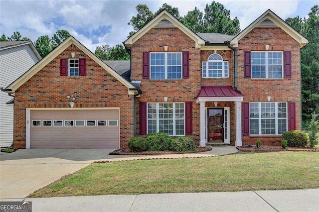 view of front facade featuring a front yard and a garage