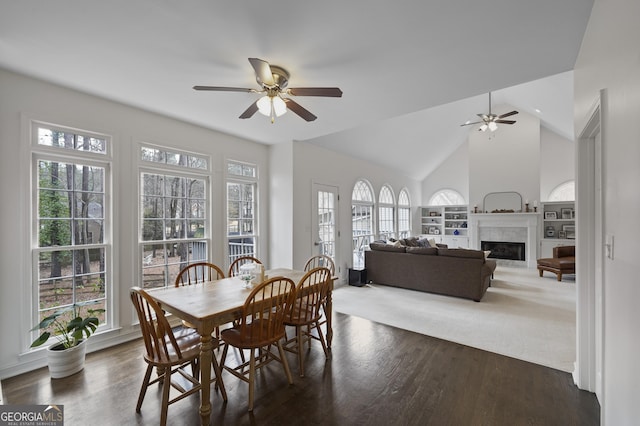 dining area with dark hardwood / wood-style floors, ceiling fan, a healthy amount of sunlight, and lofted ceiling