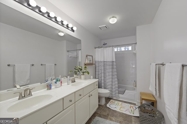 full bathroom with shower / tub combo, vanity, and toilet