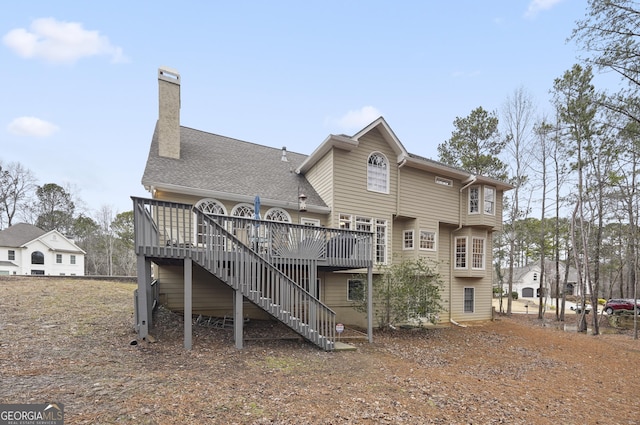 back of property featuring a deck