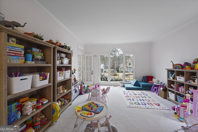 rec room featuring carpet floors and ornamental molding