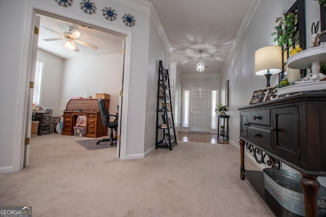 entrance foyer featuring light carpet, a textured ceiling, ceiling fan, and crown molding