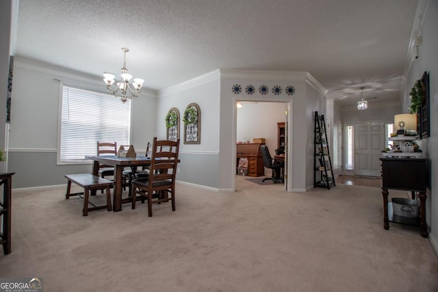 carpeted dining room featuring a textured ceiling, crown molding, and a notable chandelier