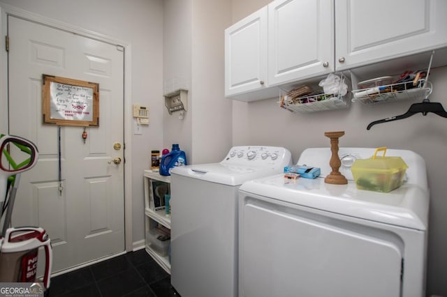 laundry room featuring cabinets and washing machine and dryer