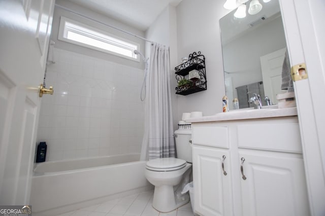 full bathroom with tile patterned flooring, vanity, toilet, and shower / bath combo with shower curtain