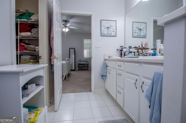 bathroom featuring ceiling fan, tile patterned flooring, and vanity