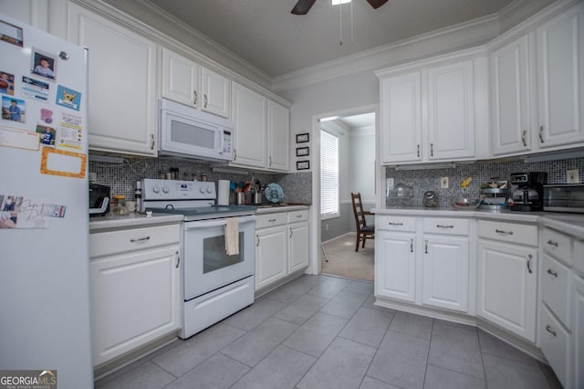 kitchen with white cabinetry, light tile patterned floors, white appliances, and ornamental molding