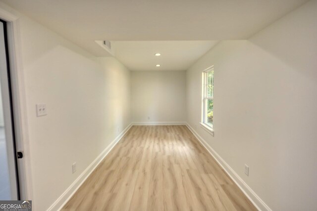 unfurnished room with light hardwood / wood-style floors