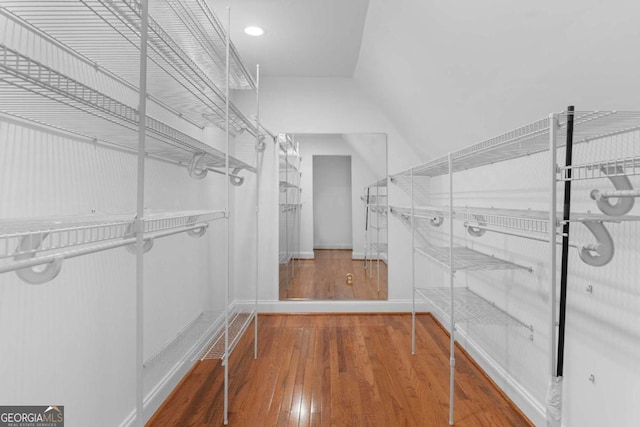 spacious closet featuring hardwood / wood-style flooring