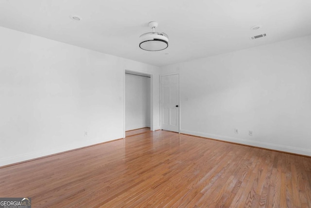 unfurnished room featuring light hardwood / wood-style floors