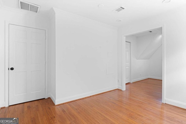 spare room featuring light hardwood / wood-style floors