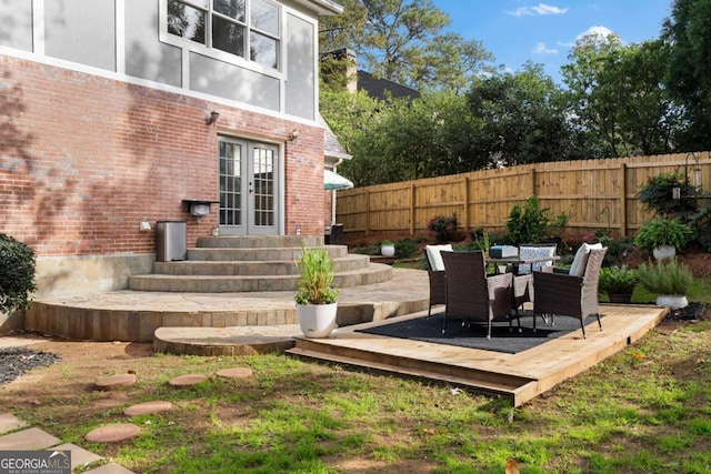 wooden deck featuring french doors