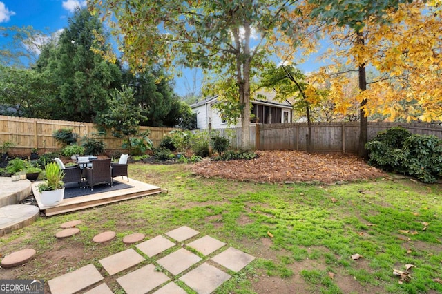 view of yard featuring a wooden deck