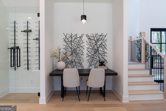 dining space with hardwood / wood-style floors