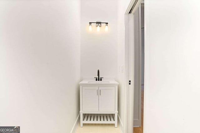 bathroom with vanity and tile patterned flooring