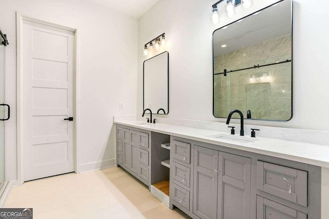 bathroom with vanity, tile patterned flooring, and walk in shower