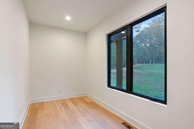 unfurnished room with light hardwood / wood-style flooring