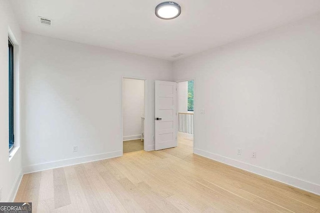 empty room with light wood-type flooring