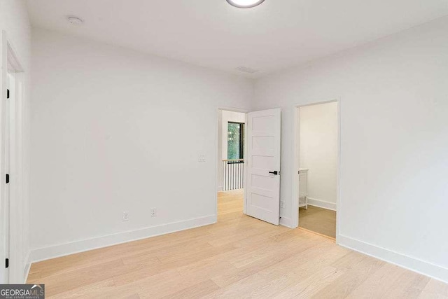 unfurnished bedroom featuring light wood-type flooring