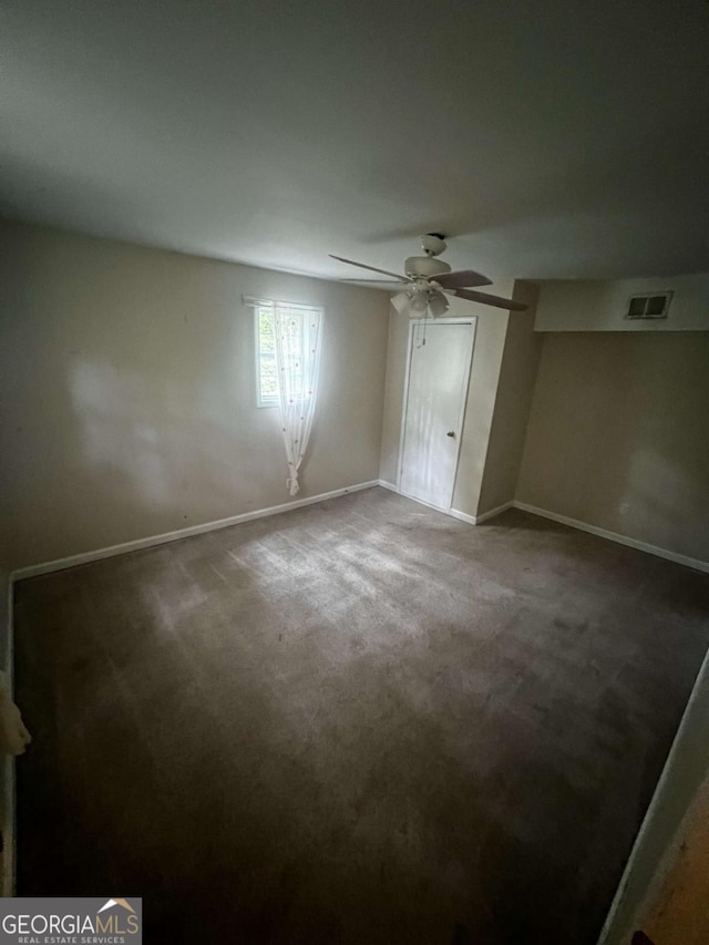 unfurnished bedroom featuring ceiling fan and carpet floors